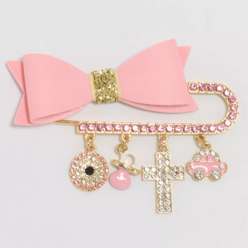 Baby hair bow pin with pink bow and gold-tone rhinestone cross, charm dangles