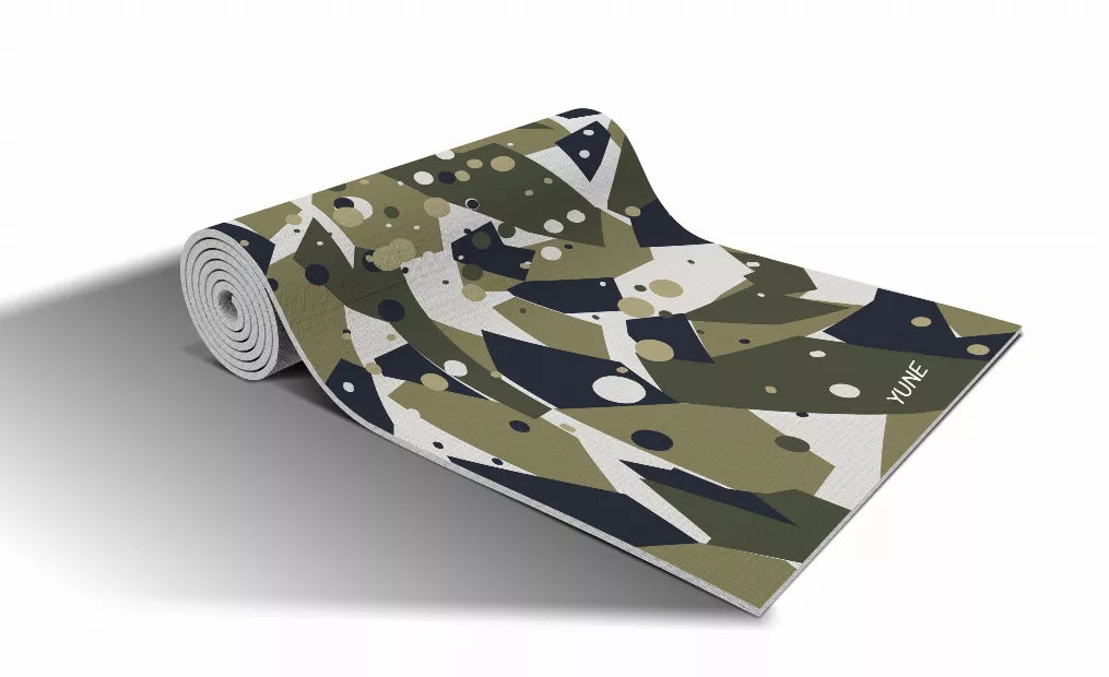 Rolled yoga mat with granite camo pattern in olive, navy and white; 'YONE' text