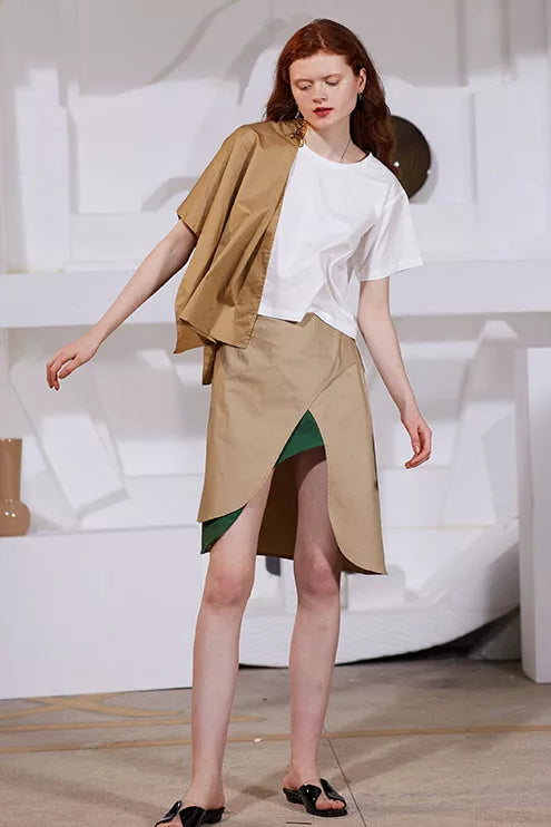 Tan high-front slit skirt with green lining and layered wrap hem