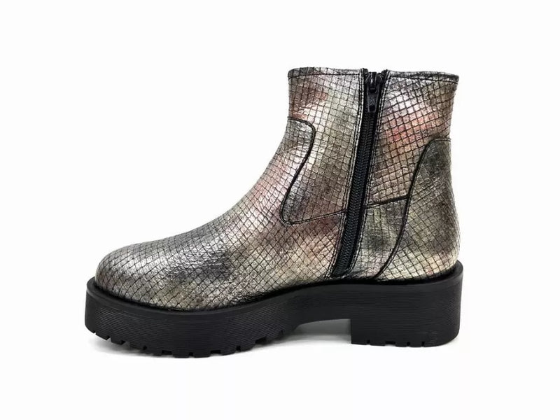 Metallic silver ankle bootie with black zipper seam and chunky lug sole