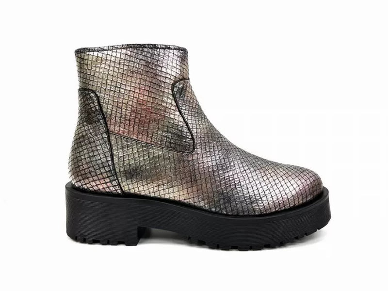 Metallic silver ankle bootie with side pull tabs and rugged lug sole