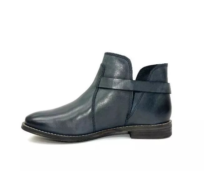 Dark teal ankle bootie with single strap across the shaft and low flat sole