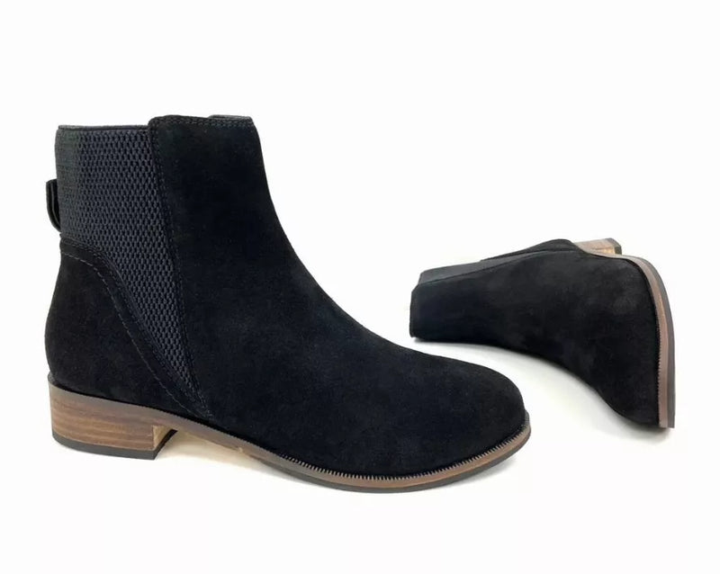 Black suede Chelsea boot with elastic gore, block heel, and heel-side view.