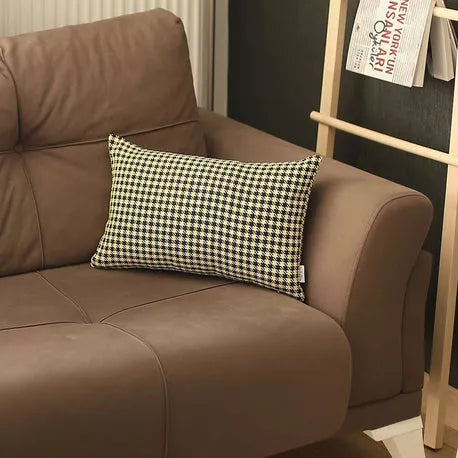 Houndstooth jacquard throw pillow on brown sofa, black-and-yellow check pattern
