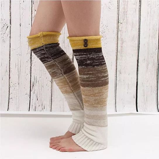 Striped winter crew socks with tan, brown and gray bands; yellow cuffs and white toes.