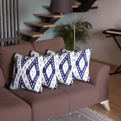 Set of 2 brown faux leather throw pillows with blue-and-white diamond patterned covers