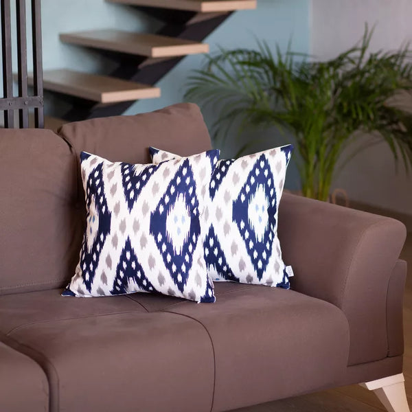Square boho pillow covers set, navy and cream ikat pattern on front panels.