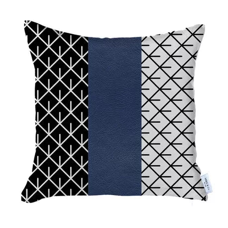 Geometric throw pillow with navy faux-leather center panel and black/white lattice panels