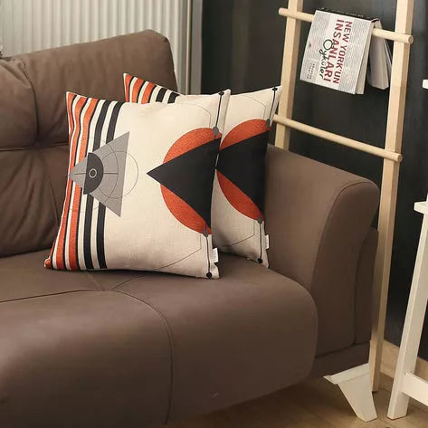 Printed throw pillow cover set, white with black, orange, and striped geometric fish