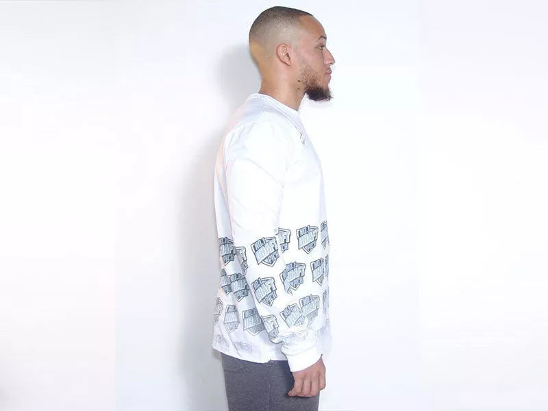 White long sleeve T-shirt with faded blue graphic print across the sleeves