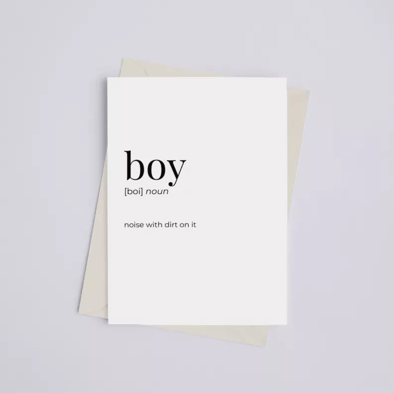 Greeting card print with “boy” and caption text, white card over kraft backing