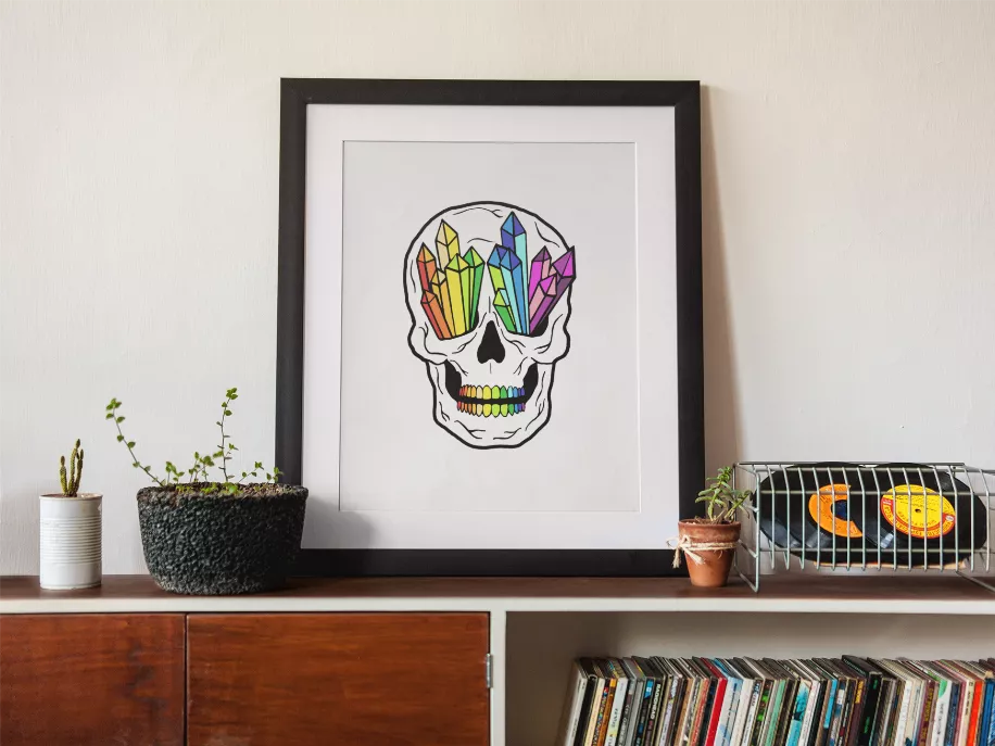 Framed crystal skull artwork with rainbow geometric crystal shapes and detailed teeth