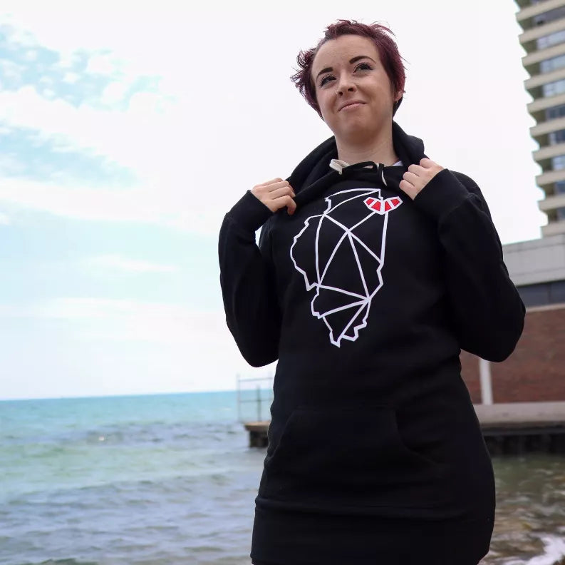 Black hooded pullover dress with white animal graphic and red accent, front pose