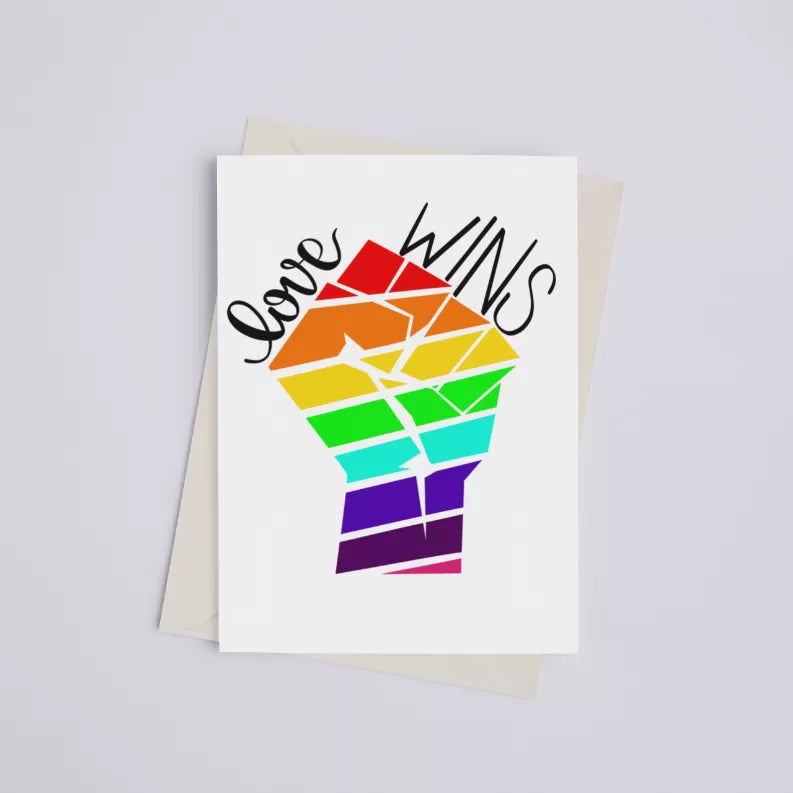 White greeting card with colorful rainbow fist graphic and 'Love Wins' text