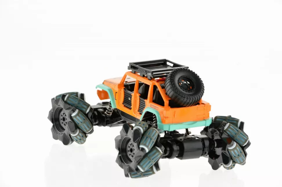 Side view of orange and teal toy monster truck with spare tire and blue claw wheels