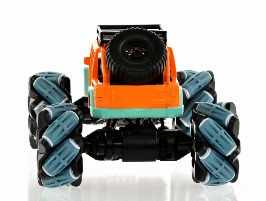 Center front view of orange and teal toy monster truck with spare tire and four blue wheels