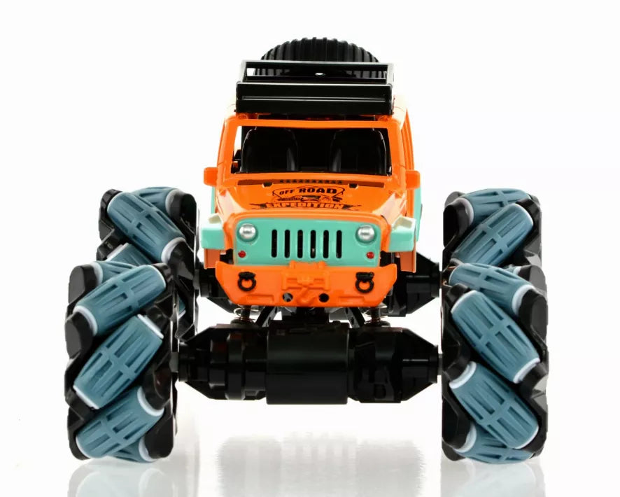 Front view of orange and teal toy monster truck, grill and headlights visible