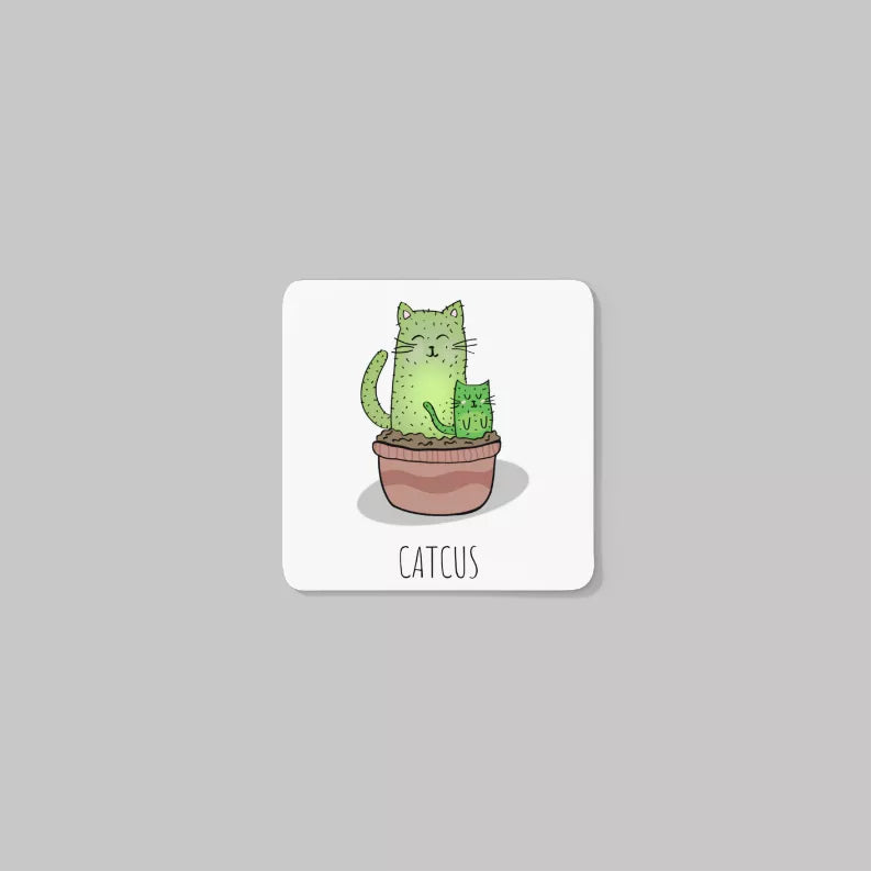 Rounded-square white coaster with green cactus cat graphic and “CATCUS” text