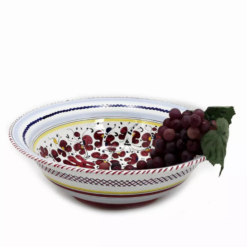 Rooster serving bowl in profile with blue rim, red design, and grapes with green leaves.