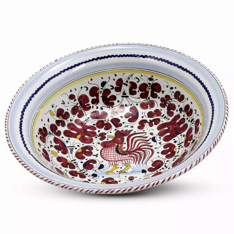Serving bowl with blue scalloped edge and red rooster motif for pasta or salad.