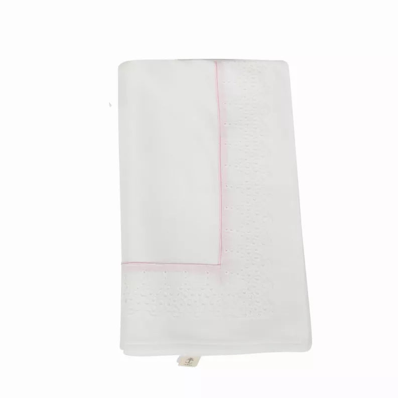 White baby blanket with pink edge trim and subtle eyelet embroidery