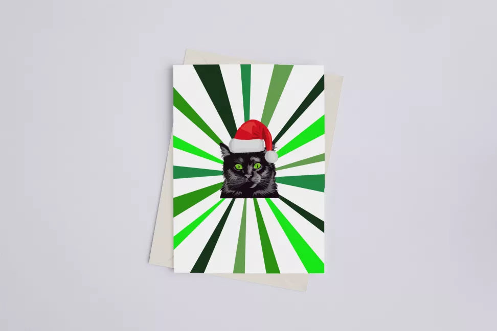 Christmas cat greeting card with green-and-white sunburst and Santa hat black cat