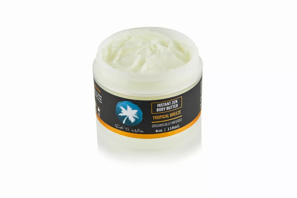Tropical breeze body butter jar with light green cream and orange label