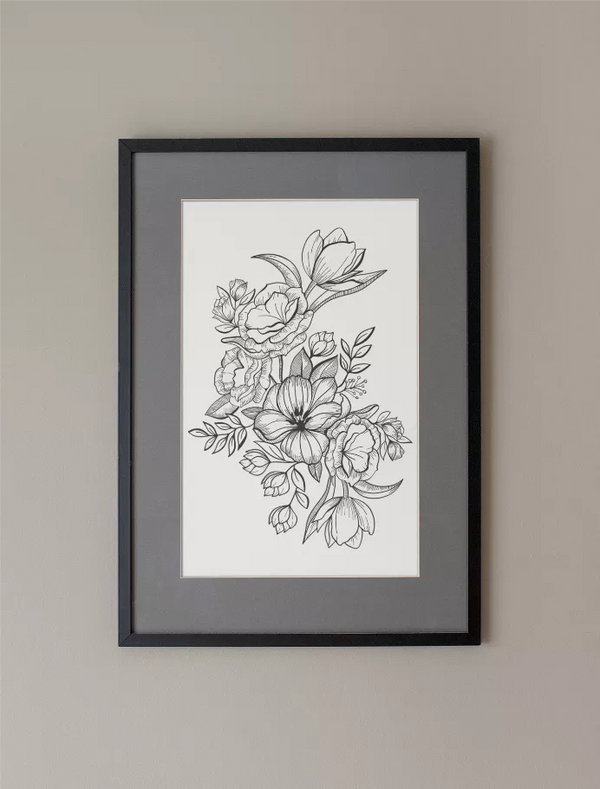 Floral line art print in black frame with white mat and monochrome bouquet illustration