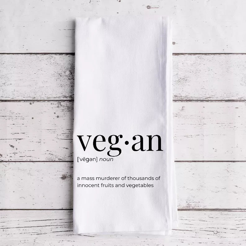 White tea towel with 'veg·an' wordmark and quote about fruits and vegetables