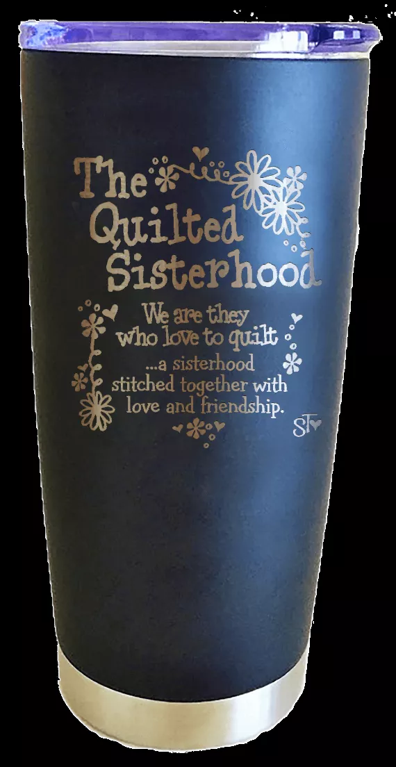 Navy-blue tumbler with "The Quilted Sisterhood" design and beige bottom band