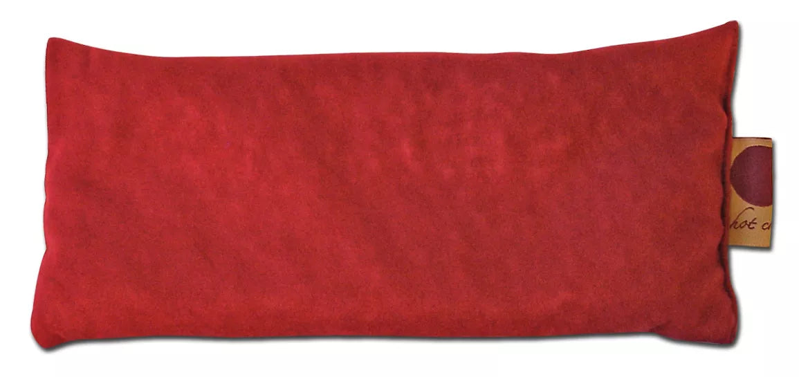 Red suede eye pillow, simple rectangular design with small side fabric label.