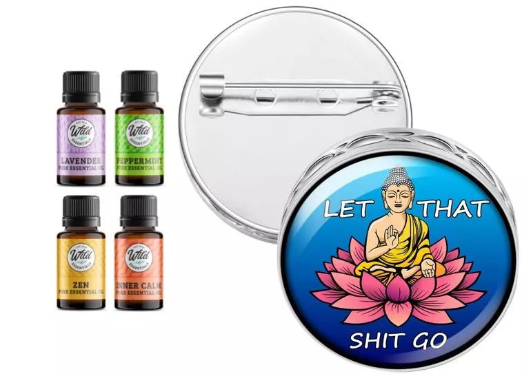 Round silver pin brooch diffuser with blue Buddha lotus artwork and four oil vials.