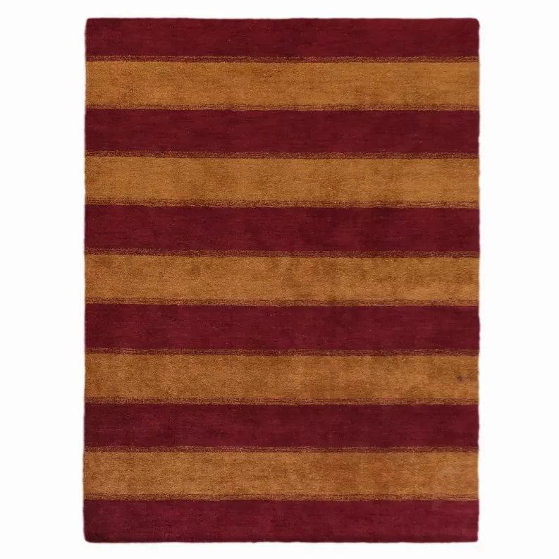 Striped area rug with horizontal burgundy and tan bands, flat woven look.