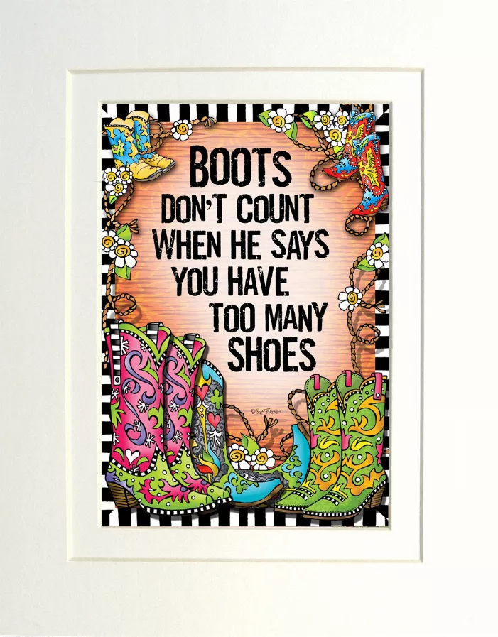 Framed quote print with colorful boots illustration and bold text, white frame