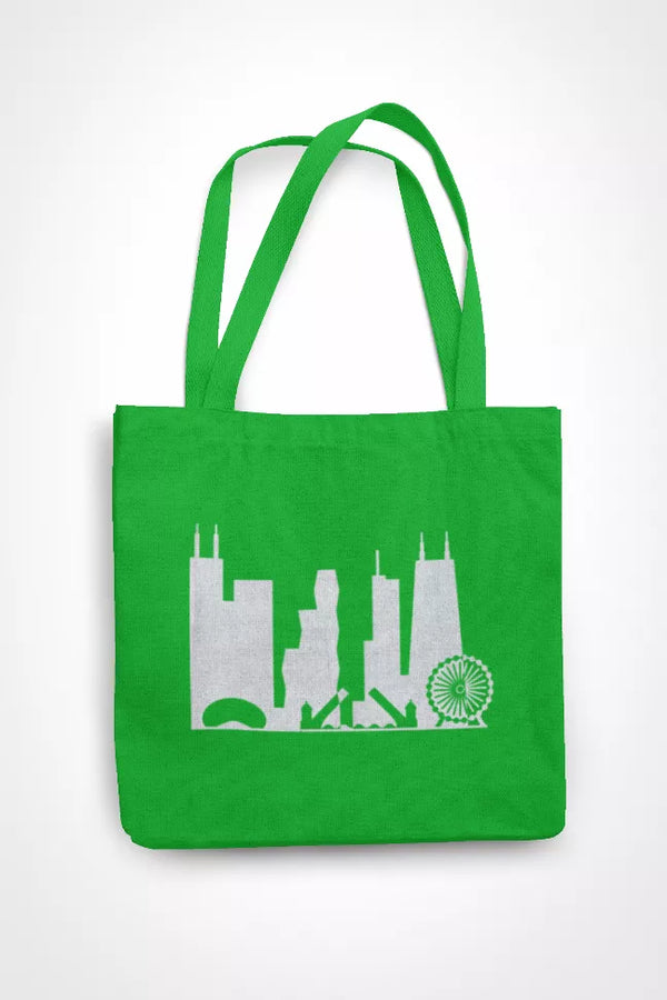 Green tote bag with long handles and white Chicago skyline silhouette with fireworks icon