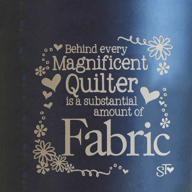 Dark blue quilt-themed tumbler with large “Fabric” quote and floral heart border