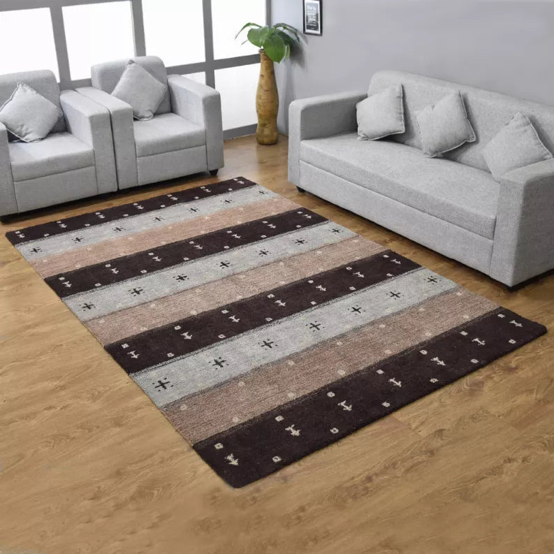 Contemporary area rug featuring horizontal stripes in dark brown, beige, and light gray