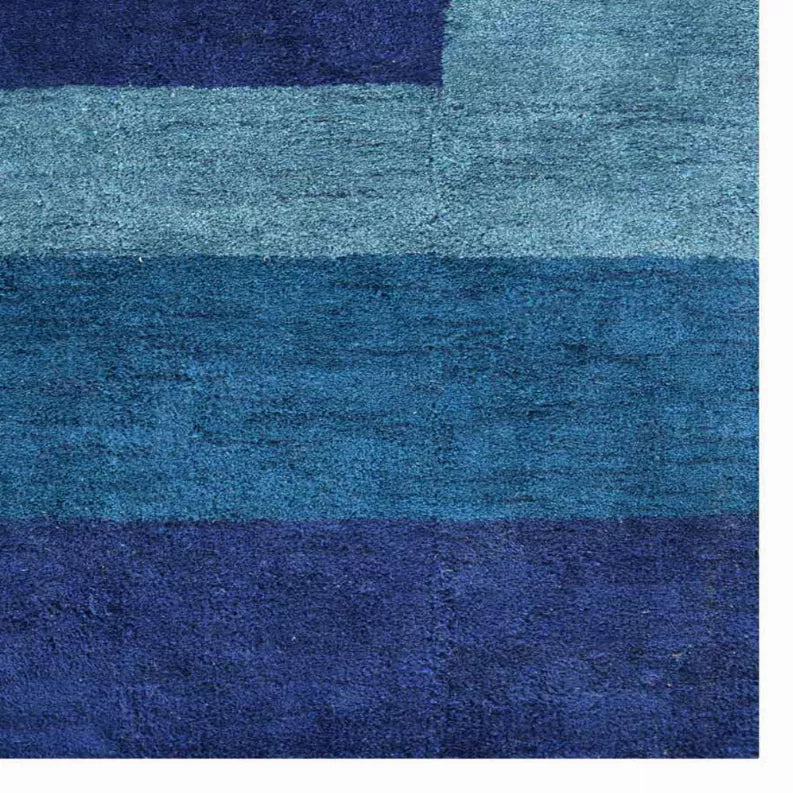 Close-up of teal and dark blue horizontal stripe rug texture