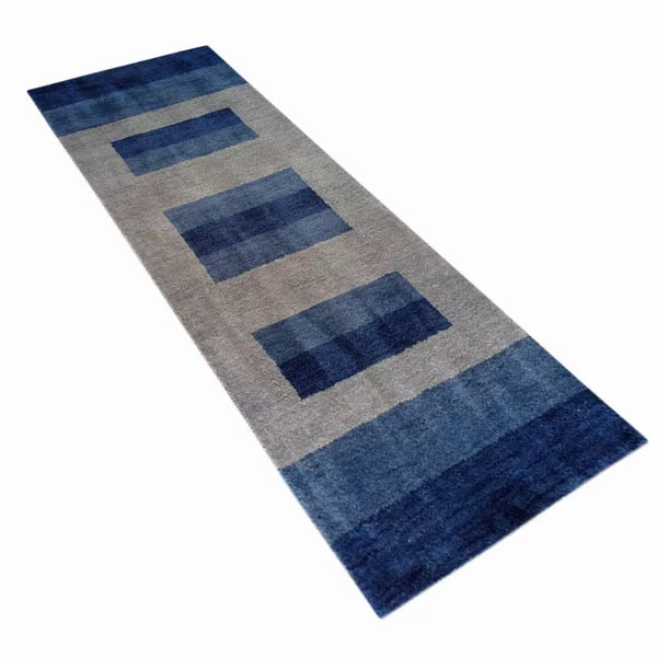 Blue and gray patterned runner rug with rectangular blocks and fringeless edges.