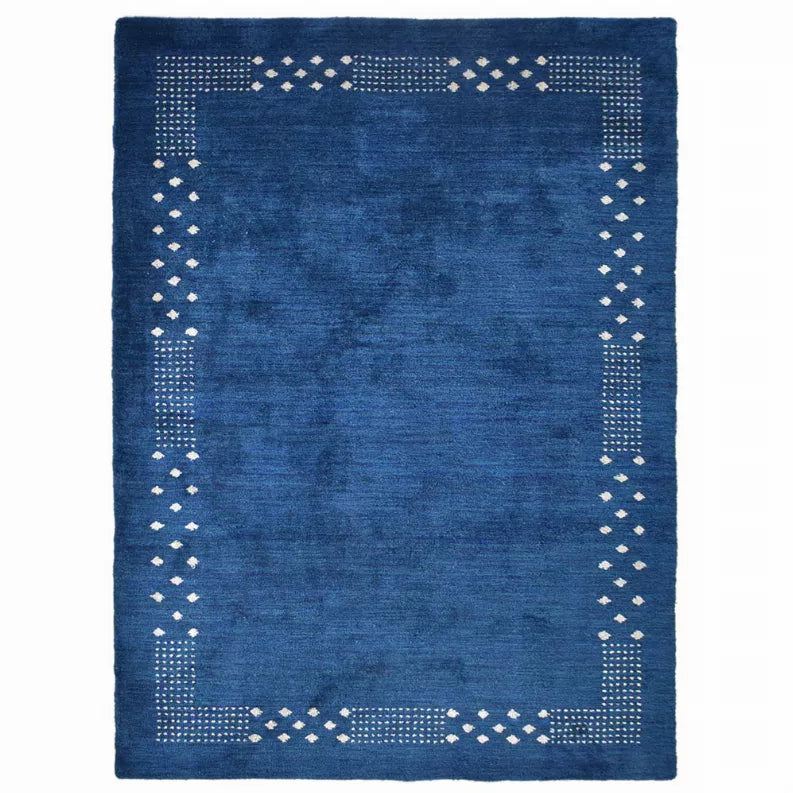 Blue hand-knotted silk mix rug with white dotted lattice trim and corner motifs