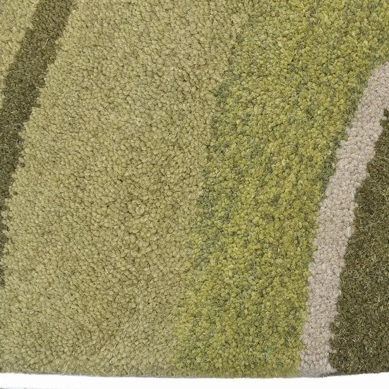 Rug pile close-up: olive and light gray loops with dark brown vertical stripe.