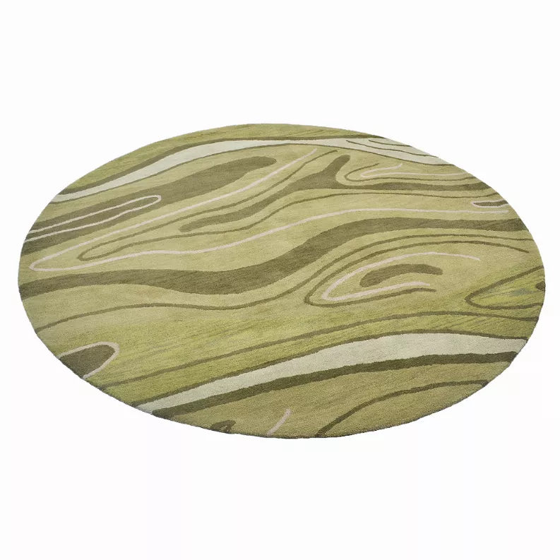 Round wool area rug with abstract green, olive, and beige wavy lines; round border.