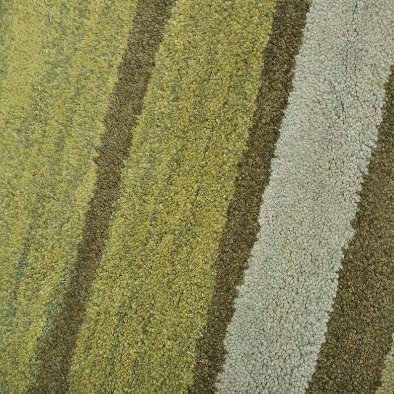 Rug pile close-up with textured lime and sage loops plus light gray and dark brown stripes.