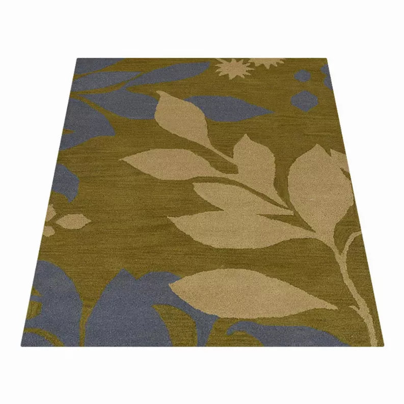 Hand-tufted wool area rug with olive and blue floral pattern, flat woven surface