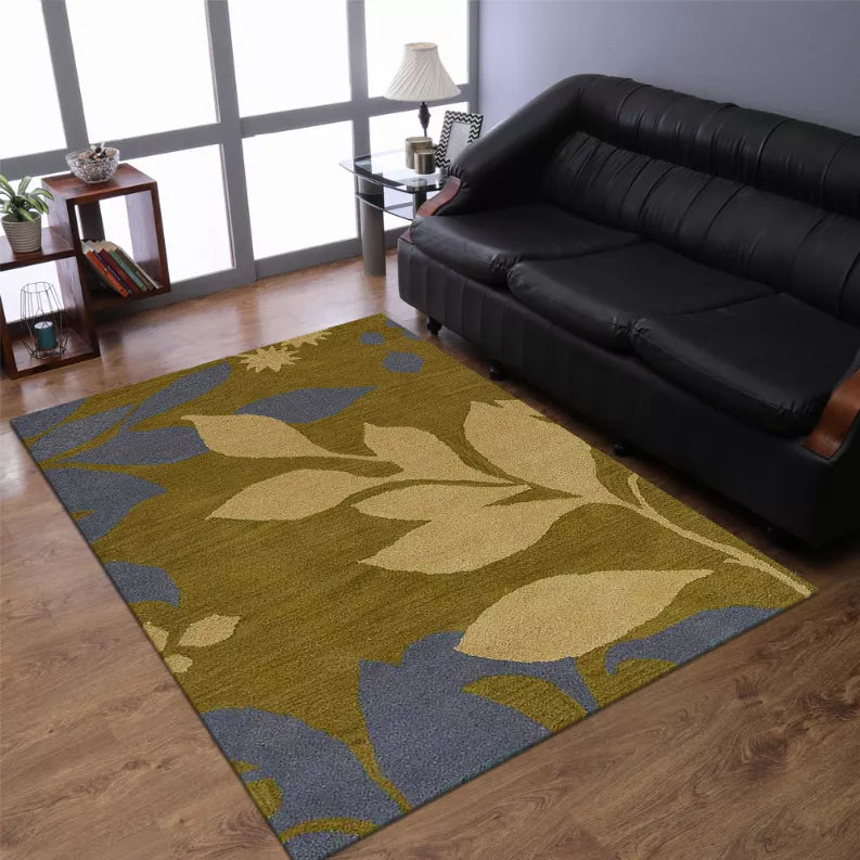 Hand-tufted wool area rug with floral pattern in olive, tan, and slate blue