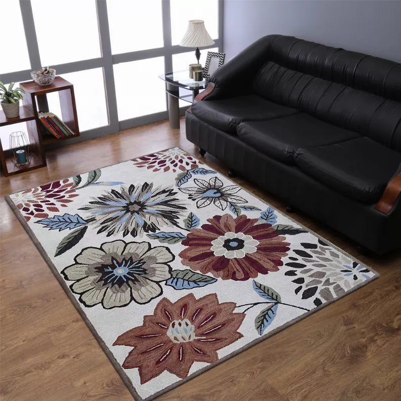 Floral area rug with multicolor blooms and leaf pattern on light background