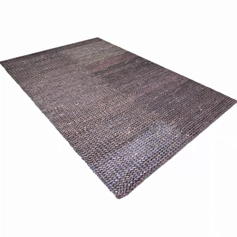 Triangular hand-woven jute area rug, solid dark gray-brown weave with tonal speckles