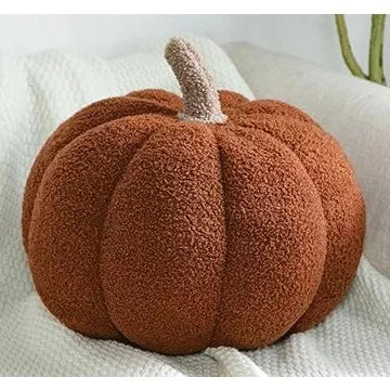 Brown boucle pumpkin throw pillow with raised ridges and beige stem