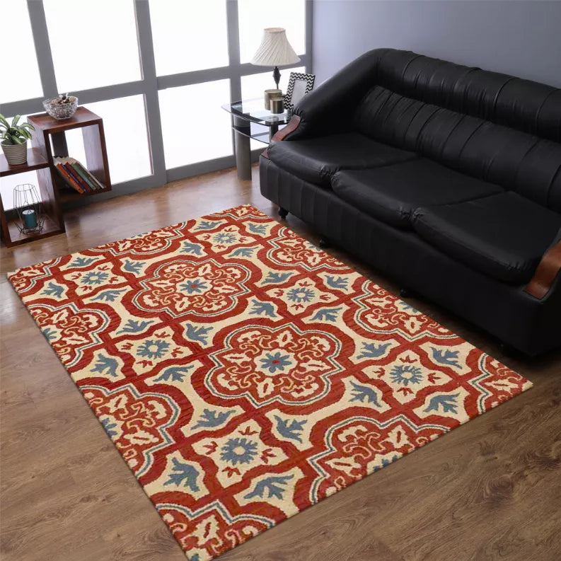 Floral patterned area rug with red, blue, and cream medallions and lattice border