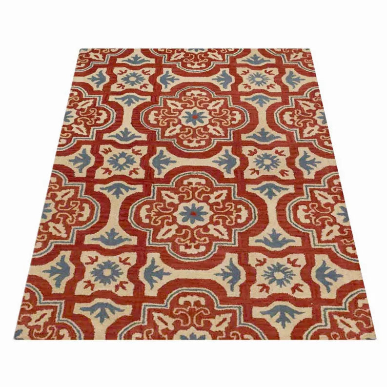 Floral area rug with repeating geometric medallions in red, blue, and cream